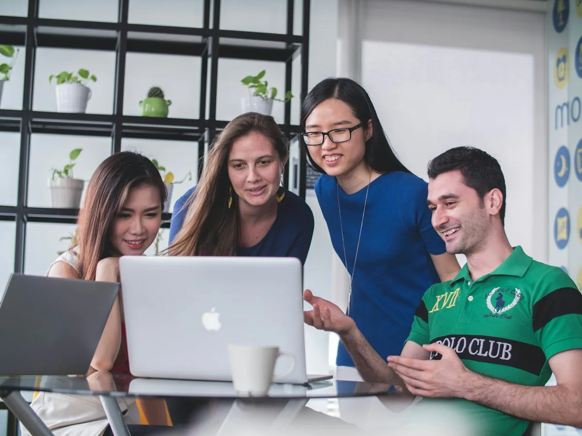 Creative startup team celebrating launch